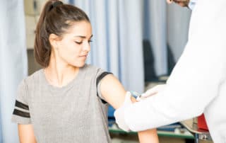 Woman patient getting vaccinated